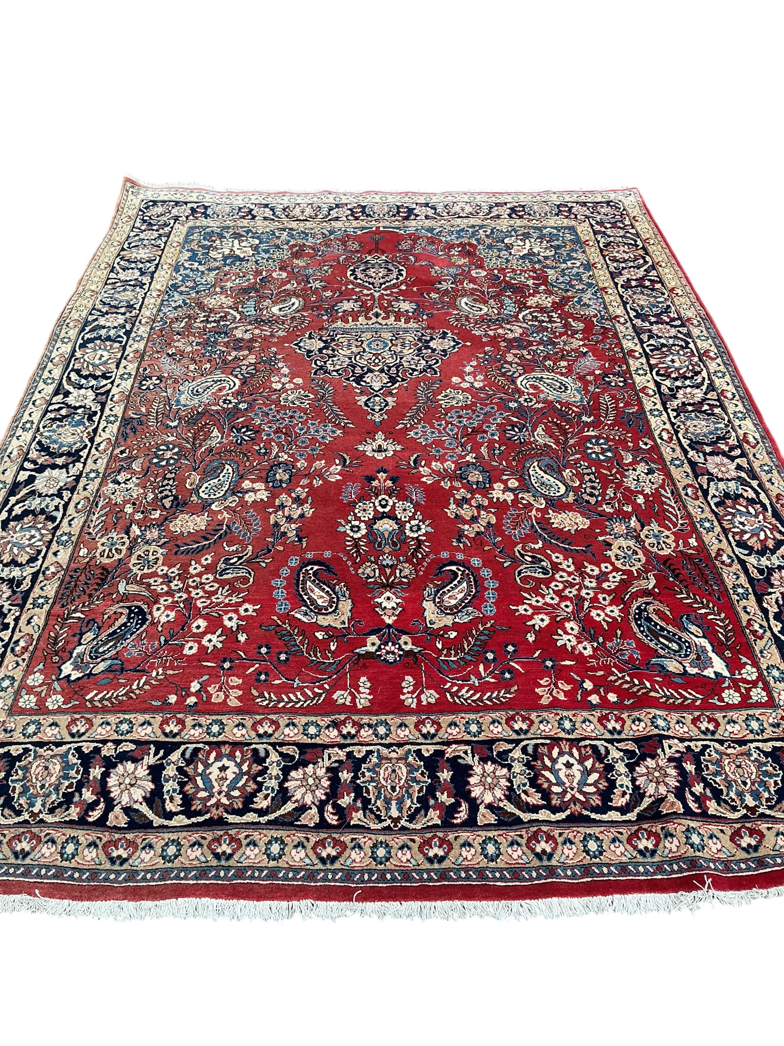 A North West Persian red ground carpet, 310 x 225cm